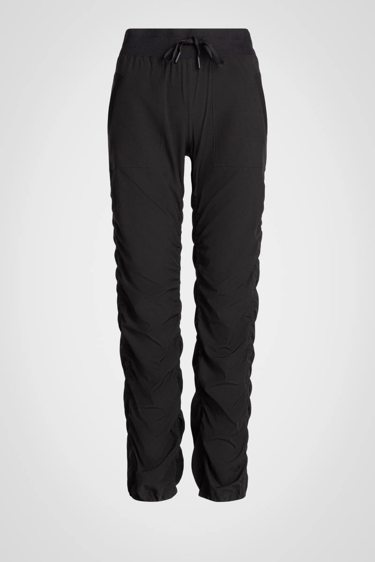 Women’s Black Adventurous Pant, front product-only view showing the drawstring waist and oversized patch pockets.