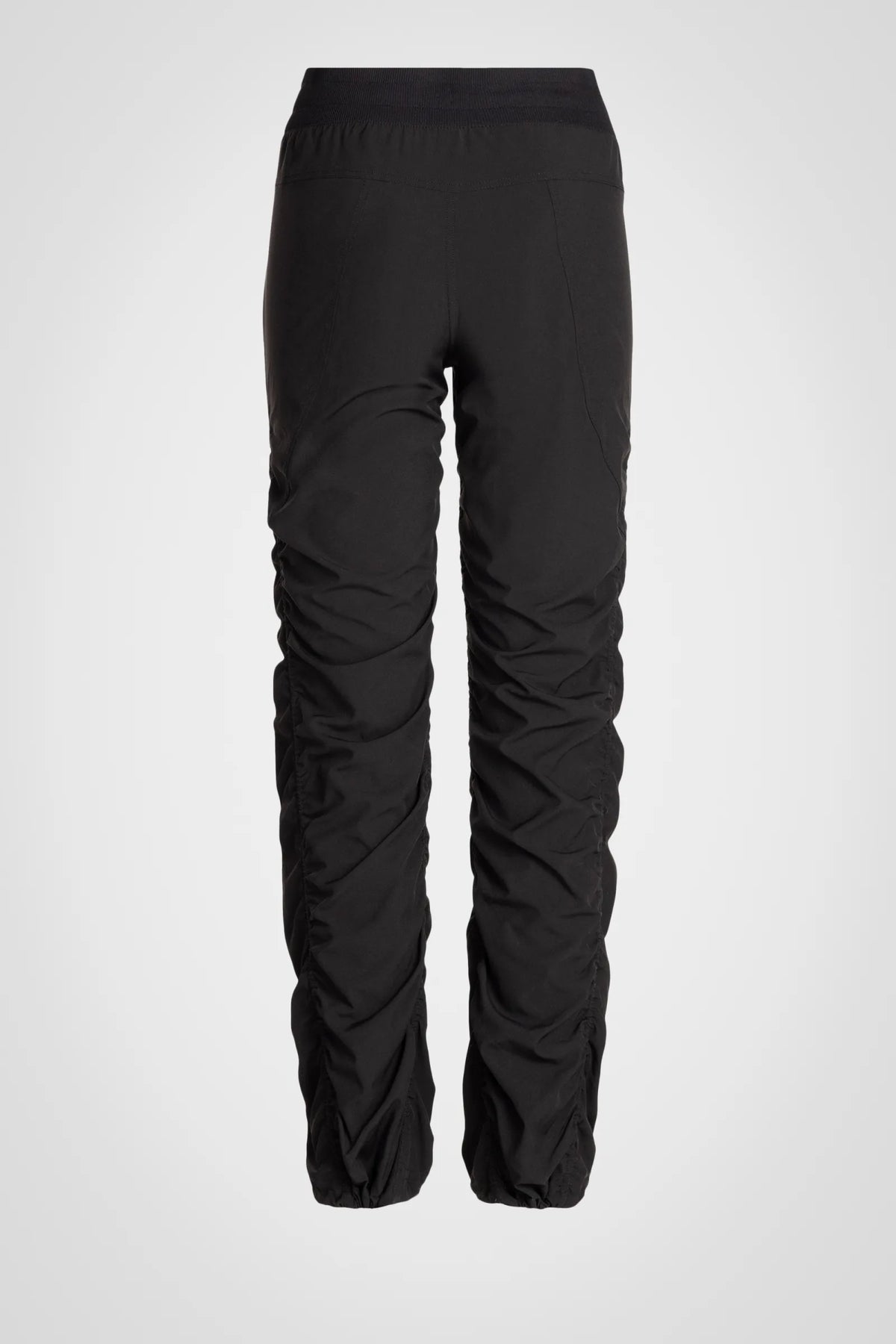 Women’s Black Adventurous Pant, rear product-only view showing the relaxed tapered silhouette and gathered cuffs.