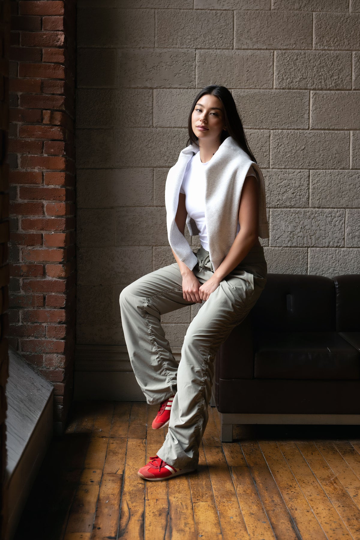 Women’s Cement Adventurous Pant, side studio view showing the utility pocket and tapered gathered hem.