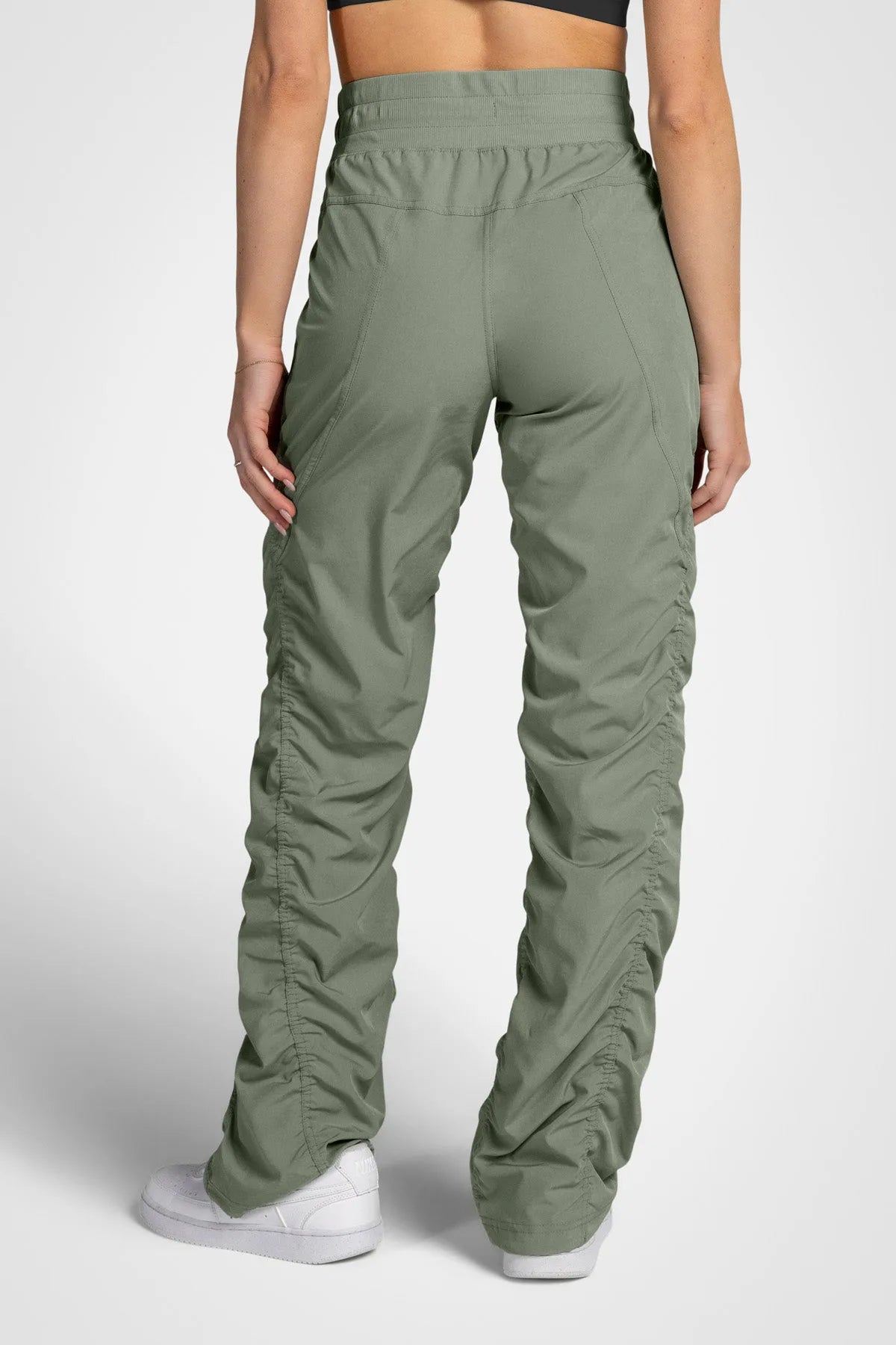 Women’s Laurel Adventurous Pant, waist and pocket close-up showing the elastic drawstring waistband and oversized utility pocket.