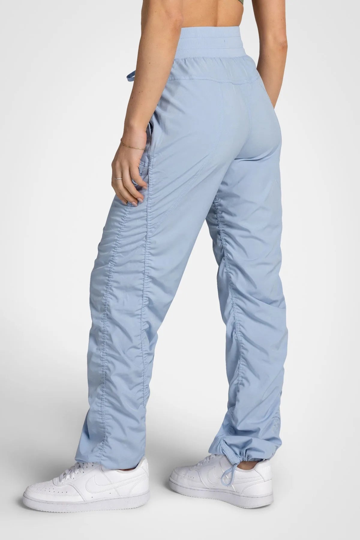 Women’s Skyway Adventurous Pant, rear studio view showing the relaxed fit through the seat and ankle.