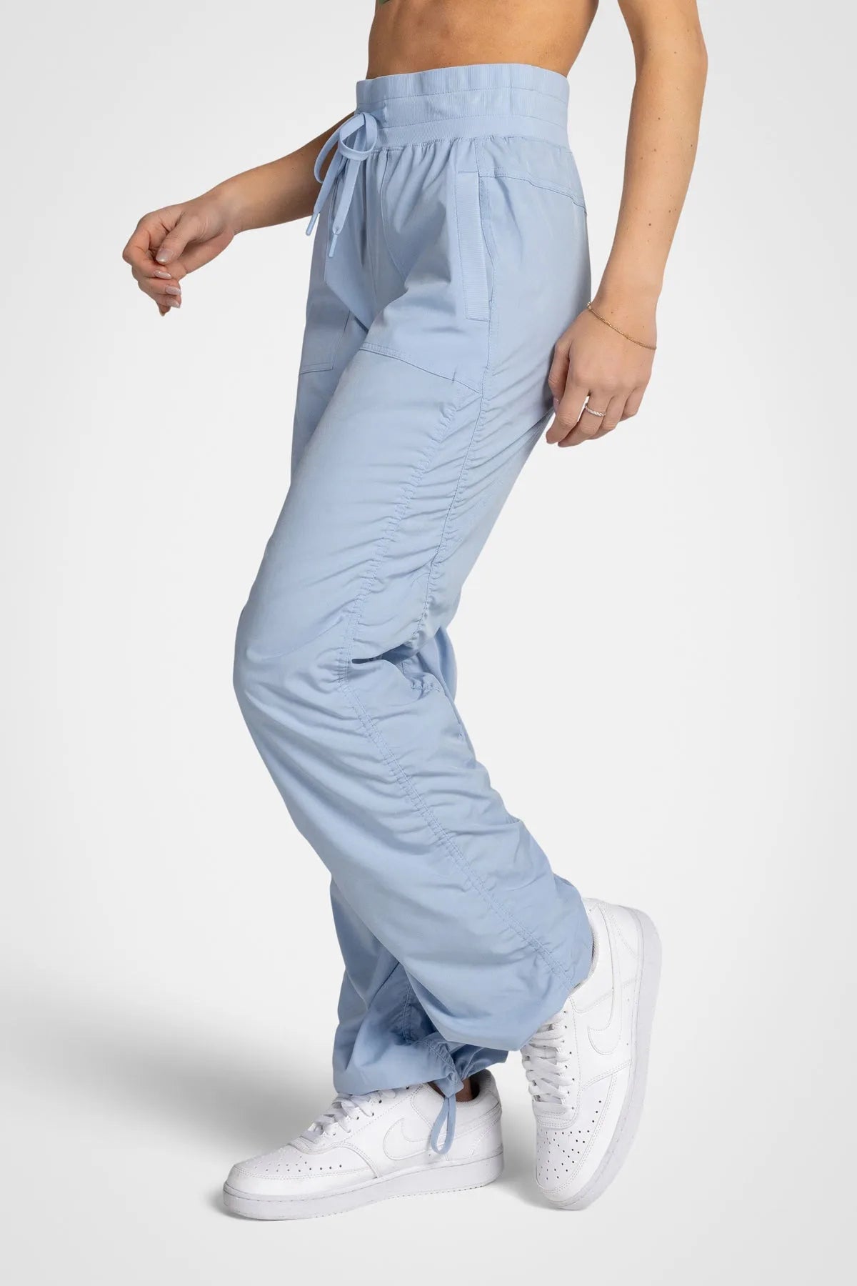 Women’s Skyway Adventurous Pant, waist and pocket close-up showing the elastic drawstring waistband and oversized utility pocket.