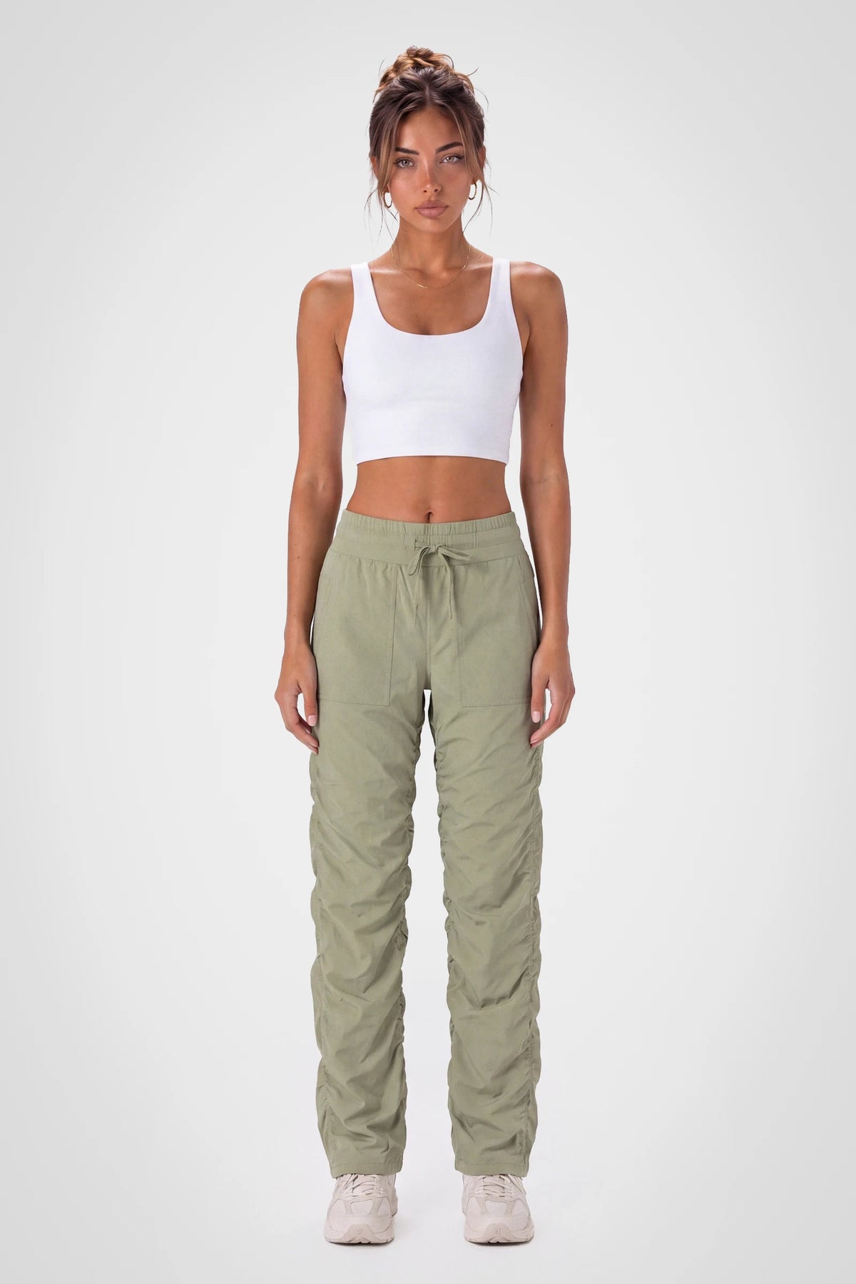 Women’s Silver Sage Adventurous Pant, side studio view showing the relaxed tapered leg, patch pocket and gathered cuff.