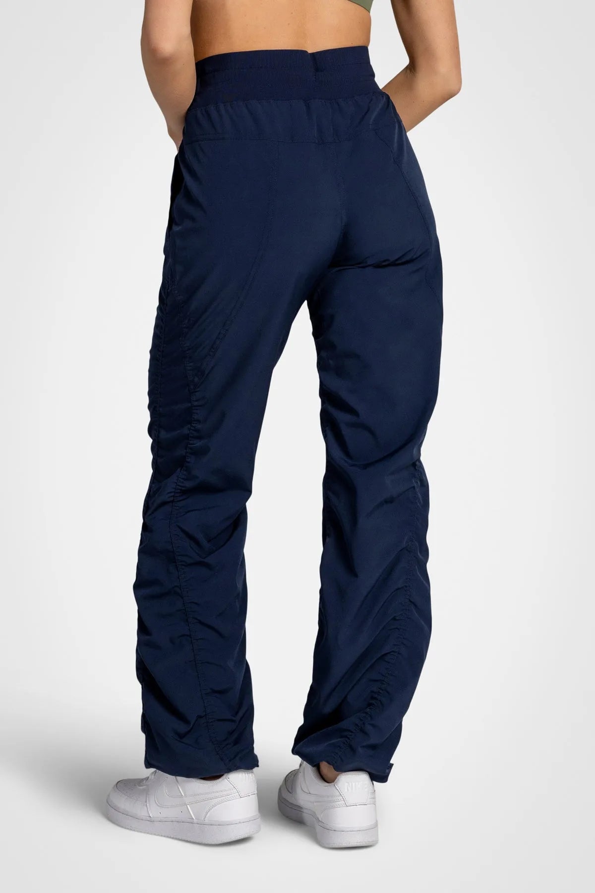Women’s Mood Indigo Adventurous Pant, waist and pocket close-up showing the elastic drawstring waistband and oversized utility pocket.