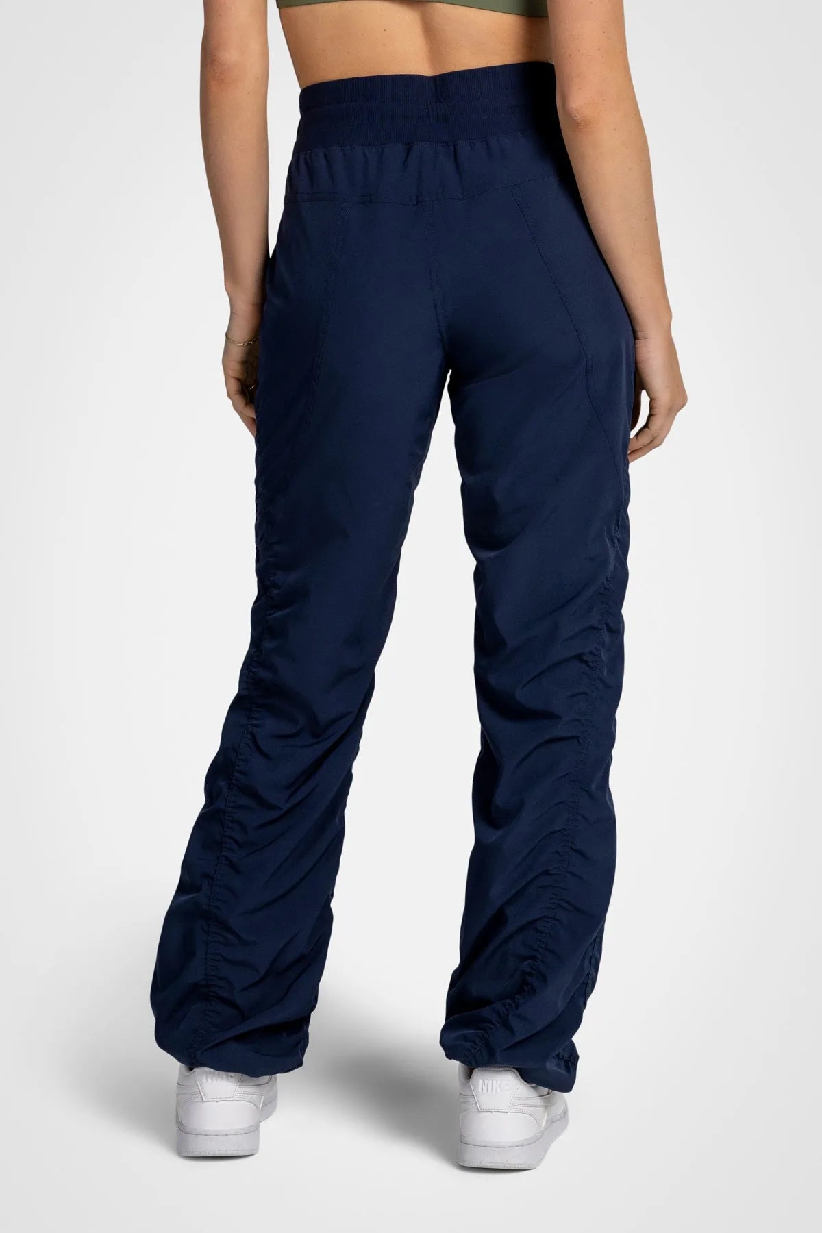 Women’s Mood Indigo Adventurous Pant, front studio view showing the patch pockets, tapered leg and gathered cuffs.