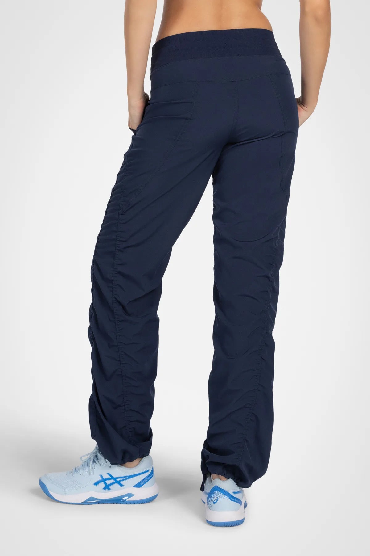 Women’s Mood Indigo Adventurous Pant, waist detail showing the elastic drawstring waistband and utility pocket.