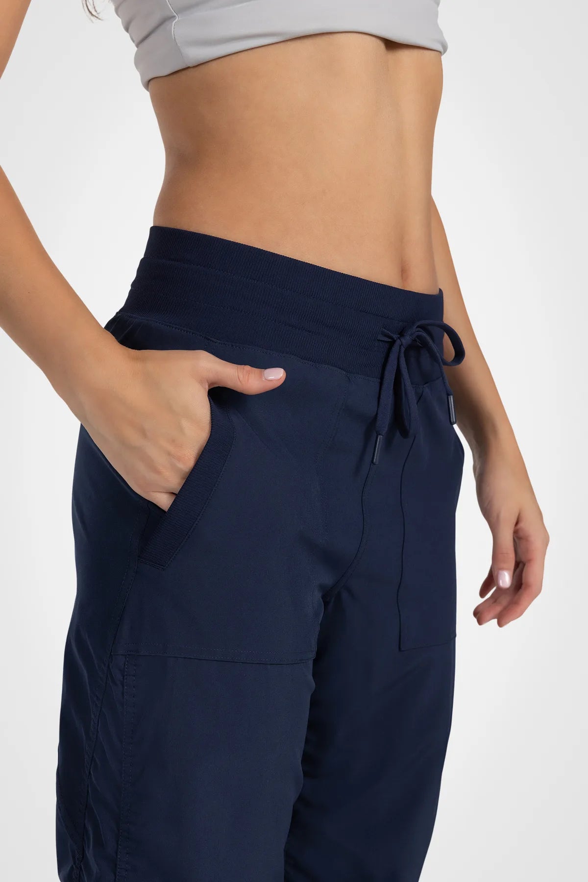 Women’s Mood Indigo Adventurous Pant, side studio view showing the relaxed tapered leg and gathered cuff.