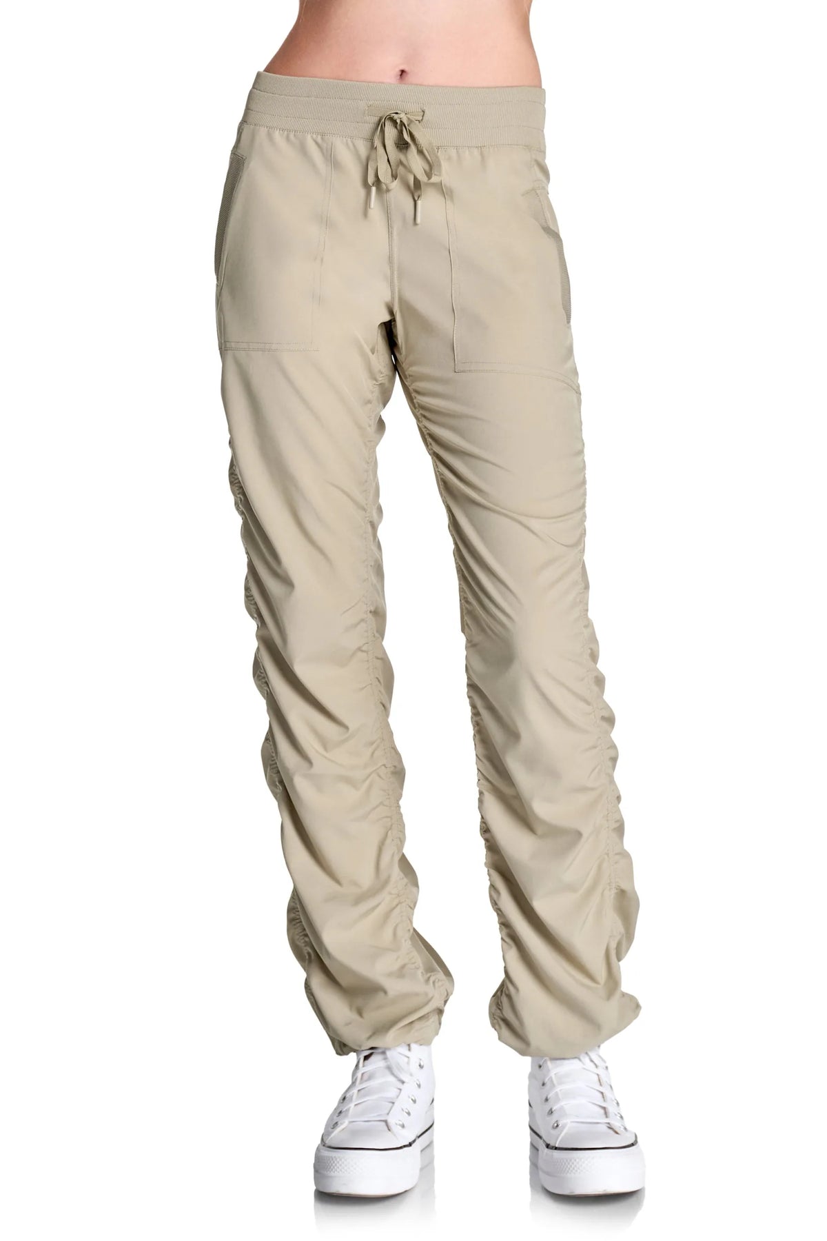 Women’s Warm Taupe Adventurous Pant, front lower-body studio view showing the elastic drawstring waist, patch pockets and gathered cuffs.