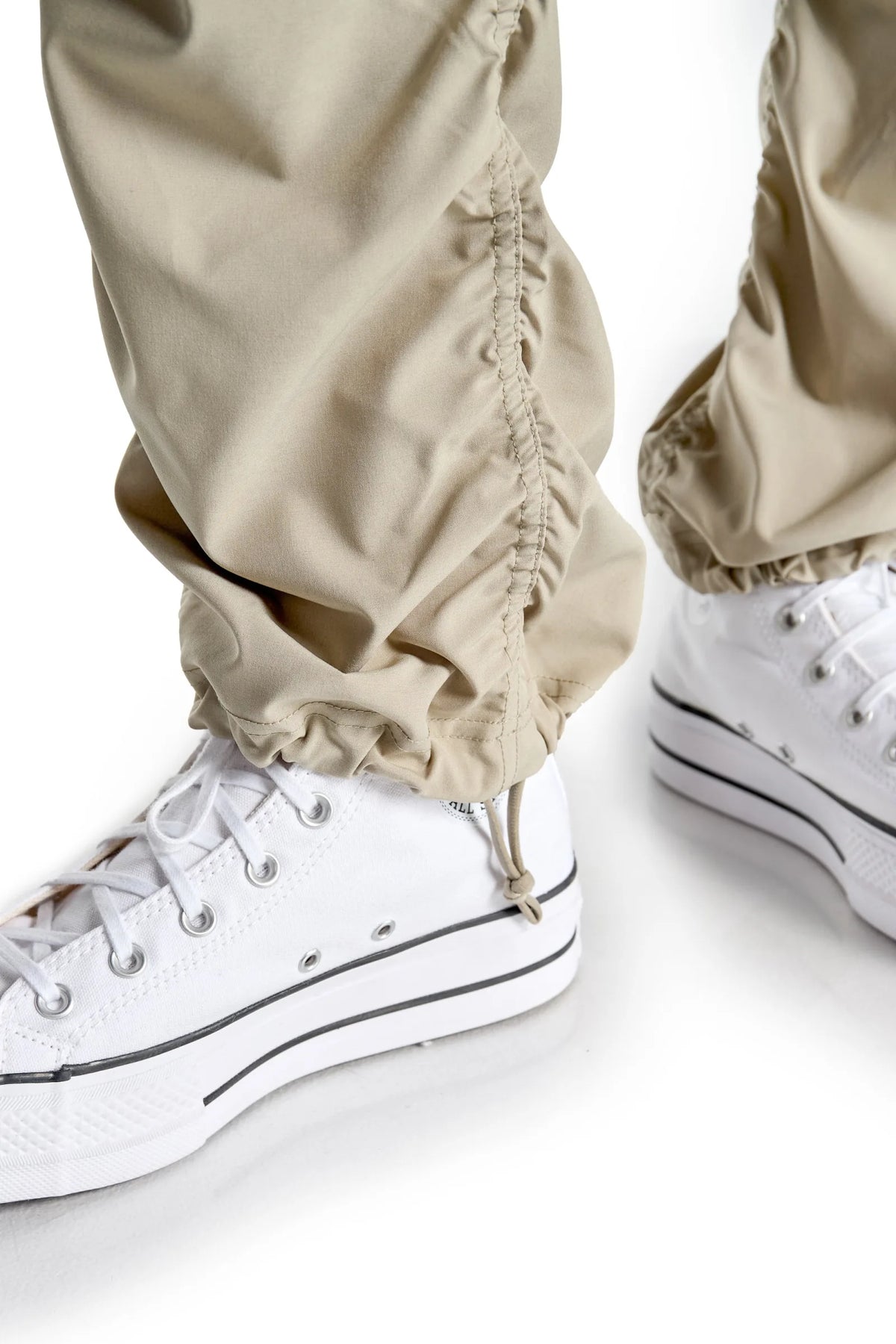 Women’s Warm Taupe Adventurous Pant, full-body studio pose showing the relaxed silhouette from waist to ankle.