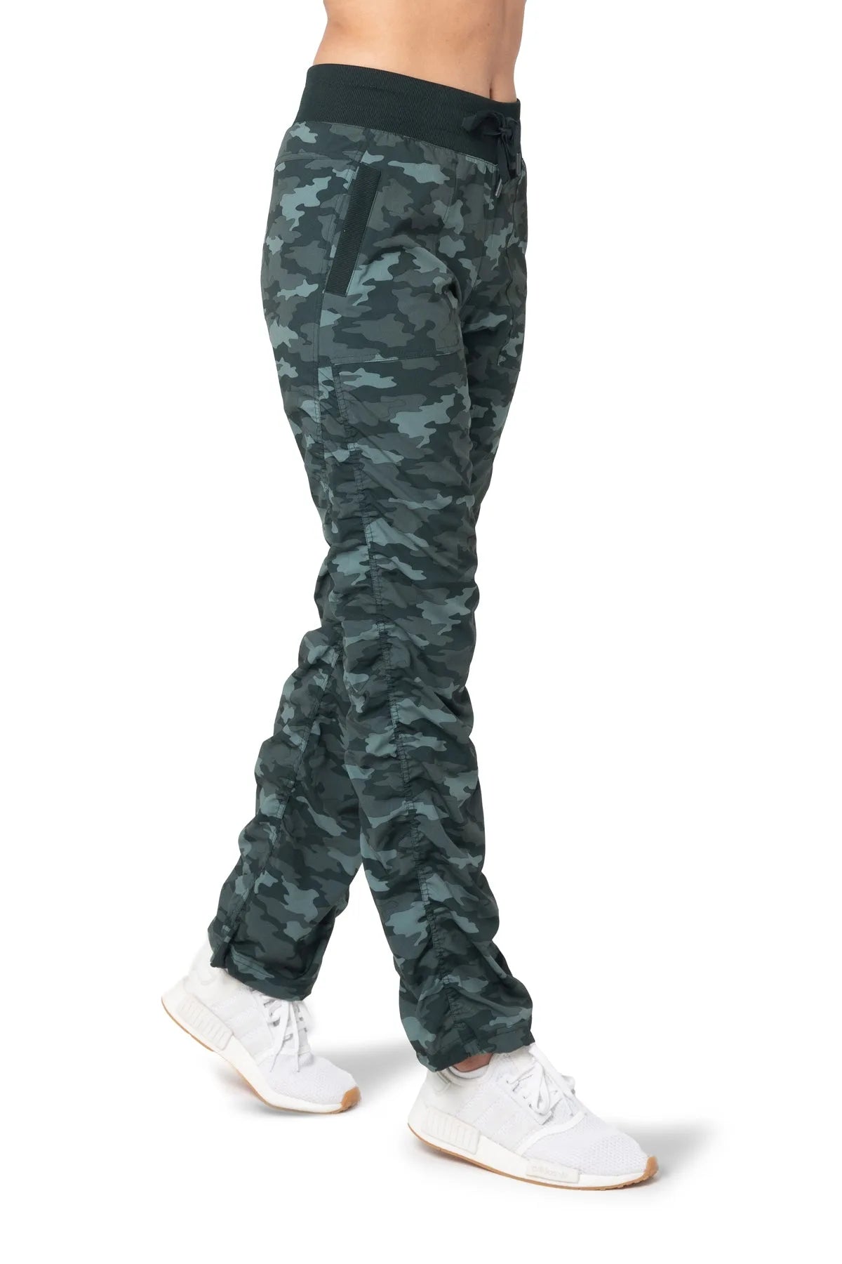Women’s Black and green camouflage print Adventurous Pant, front studio view showing the relaxed fit through the leg and gathered cuffs.