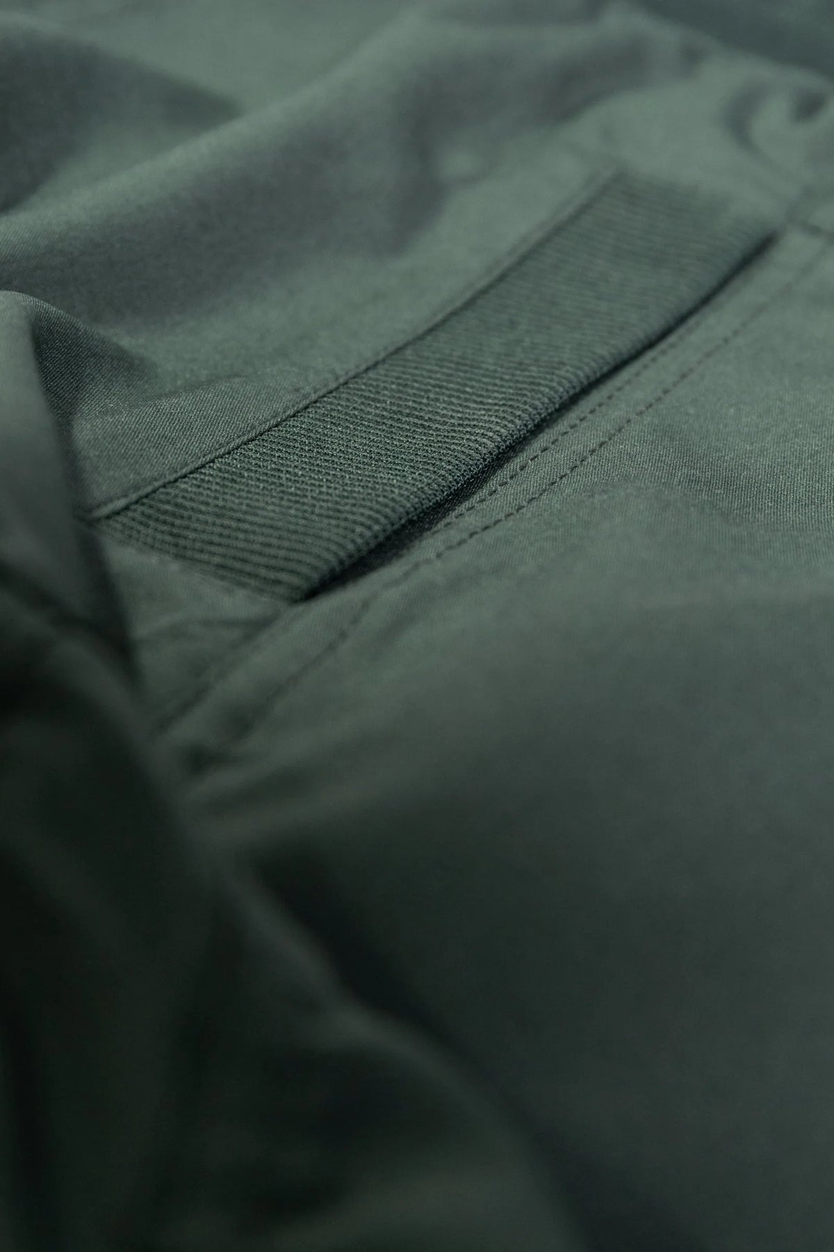 Women’s Cilantro Adventurous Pant, waist and pocket close-up showing the elastic drawstring waistband and oversized utility pocket.