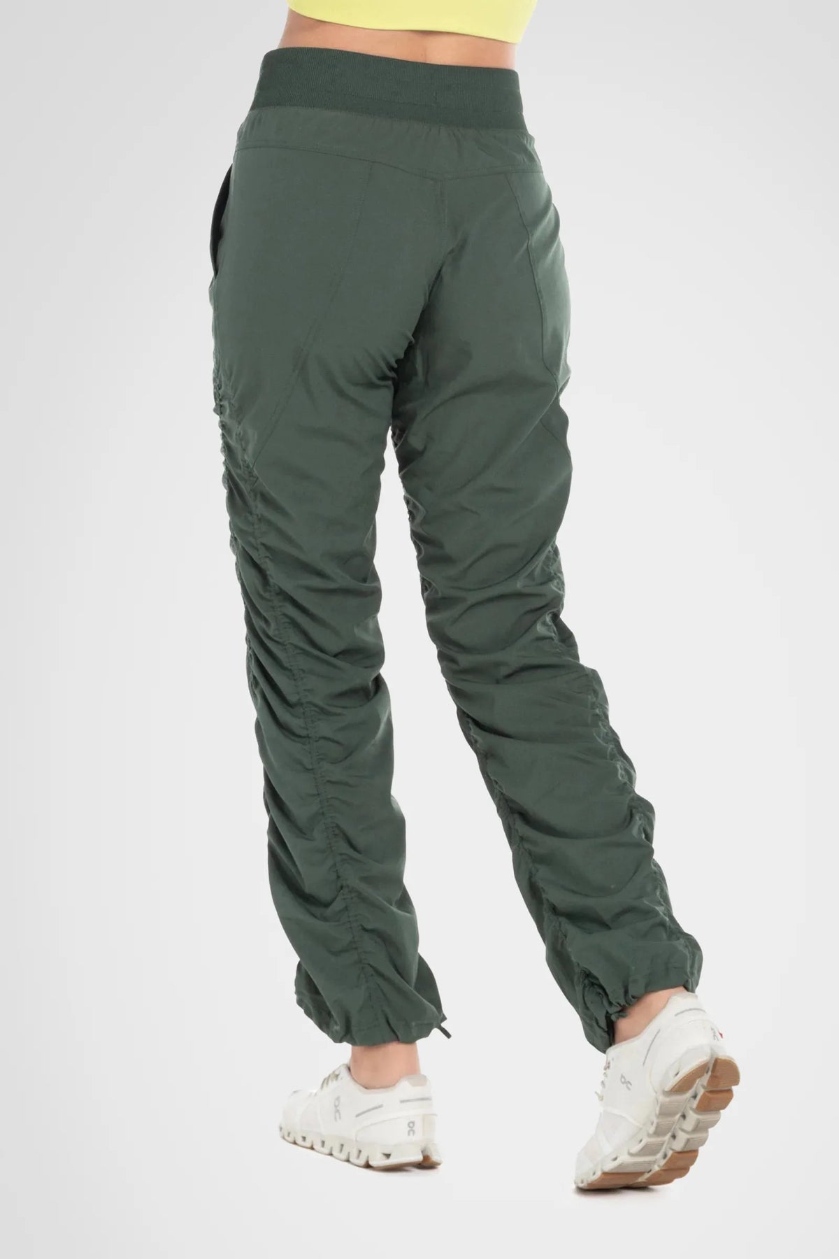 Women’s Cilantro Adventurous Pant, rear studio view showing the relaxed fit and gathered cuffs.