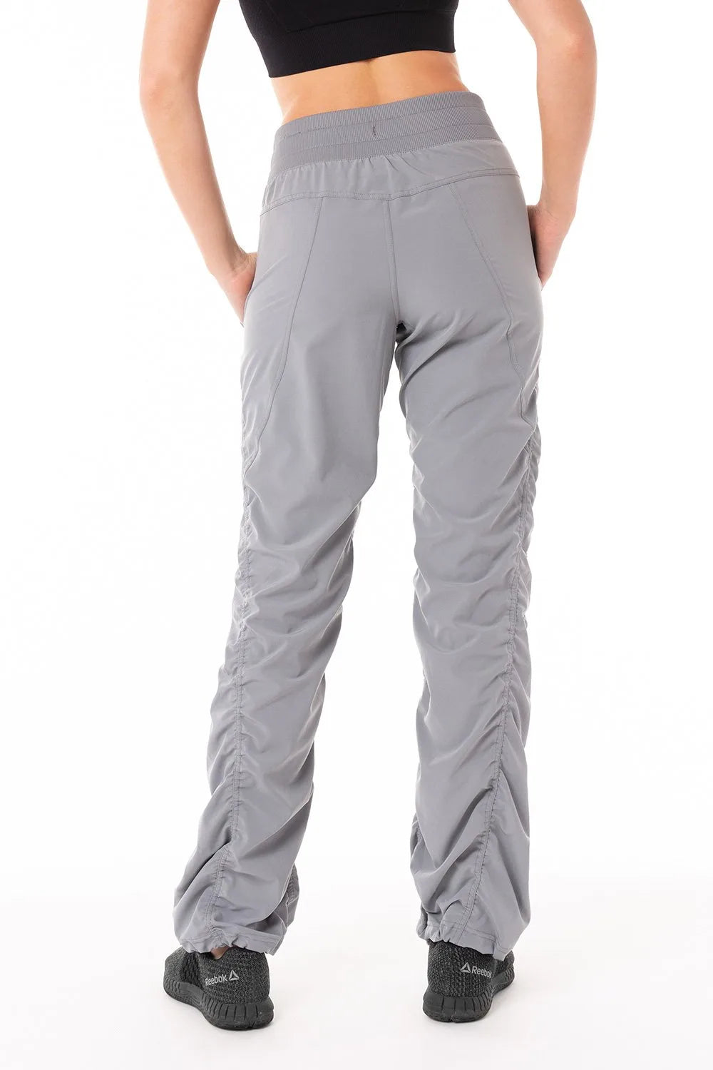 Women’s Grey camouflage print Adventurous Pant, rear studio view showing the relaxed fit through the seat and ankle.