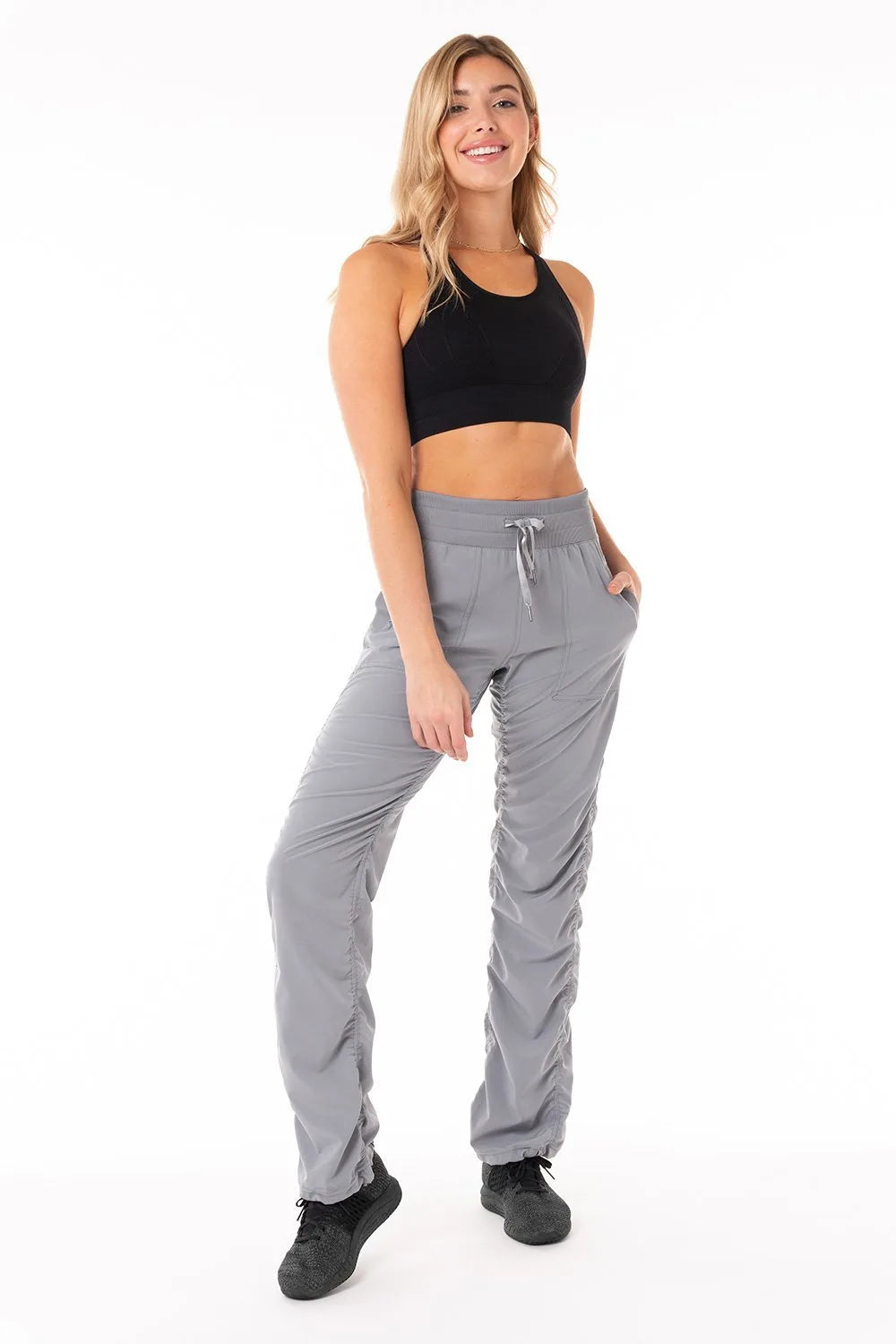 Women’s Grey camouflage print Adventurous Pant, full-body studio pose showing the relaxed silhouette from waist to ankle.