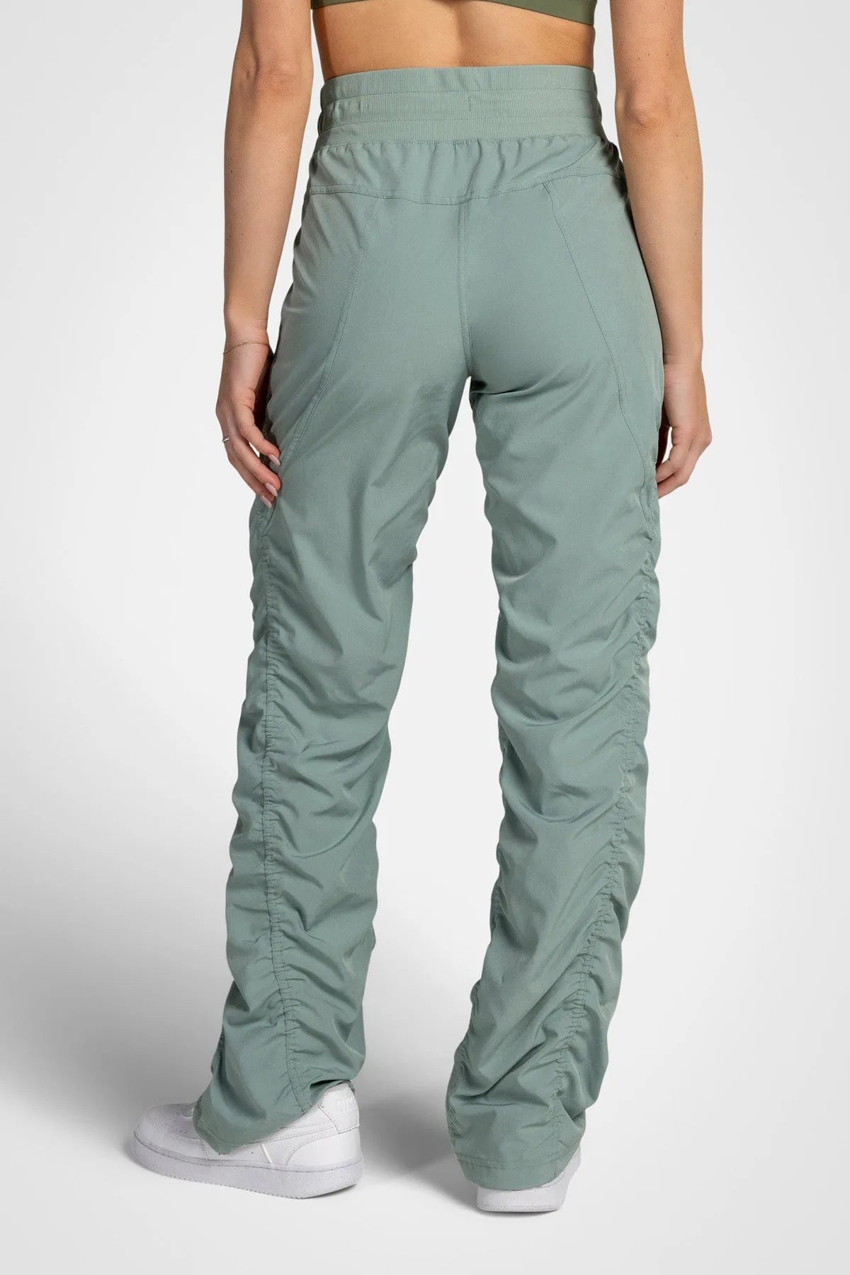 Women’s Iceberg Green Adventurous Pant, full-body studio pose showing the relaxed silhouette from waist to ankle.