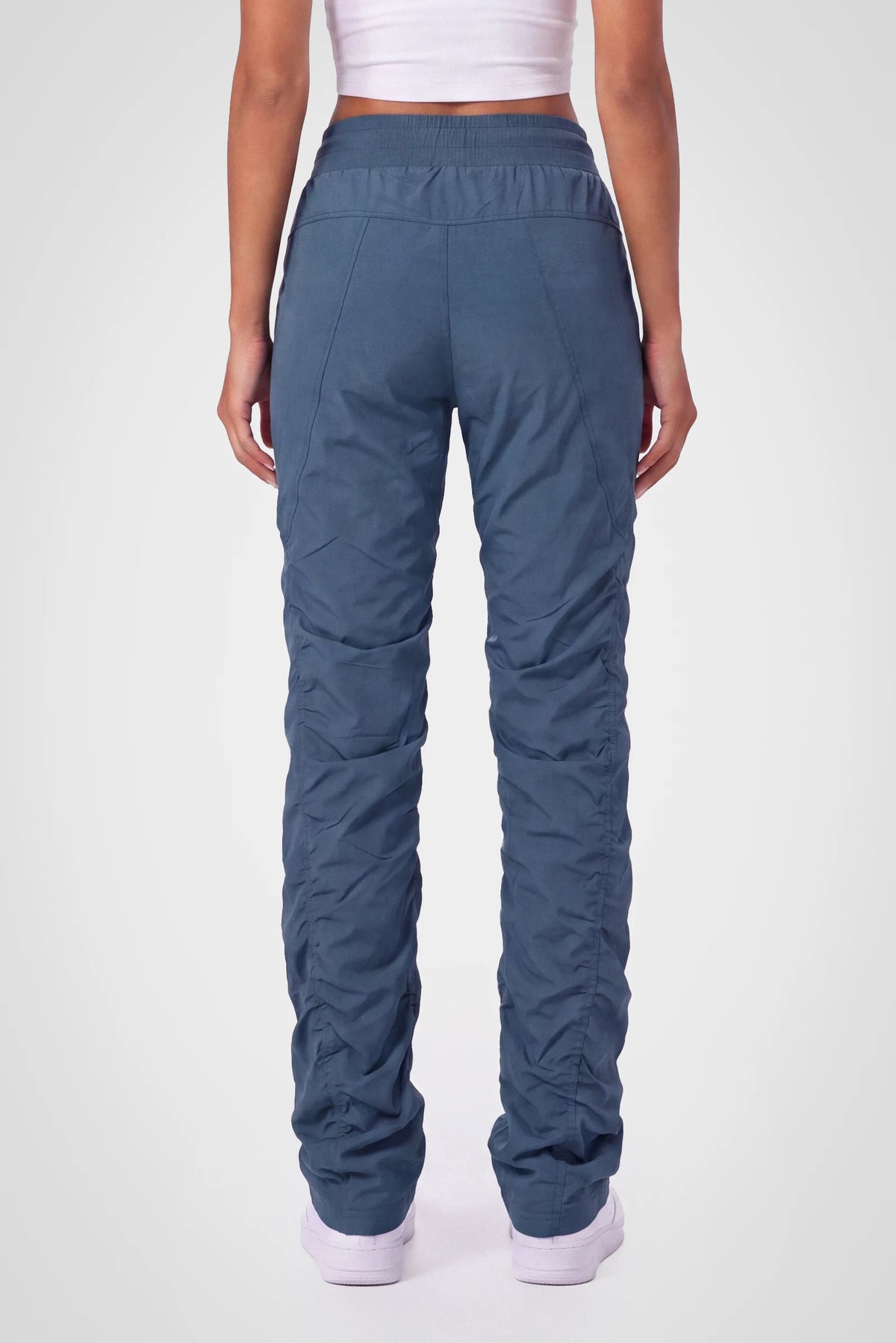 Women’s Key Largo Adventurous Pant, three-quarter studio view showing the tapered leg and gathered hem.