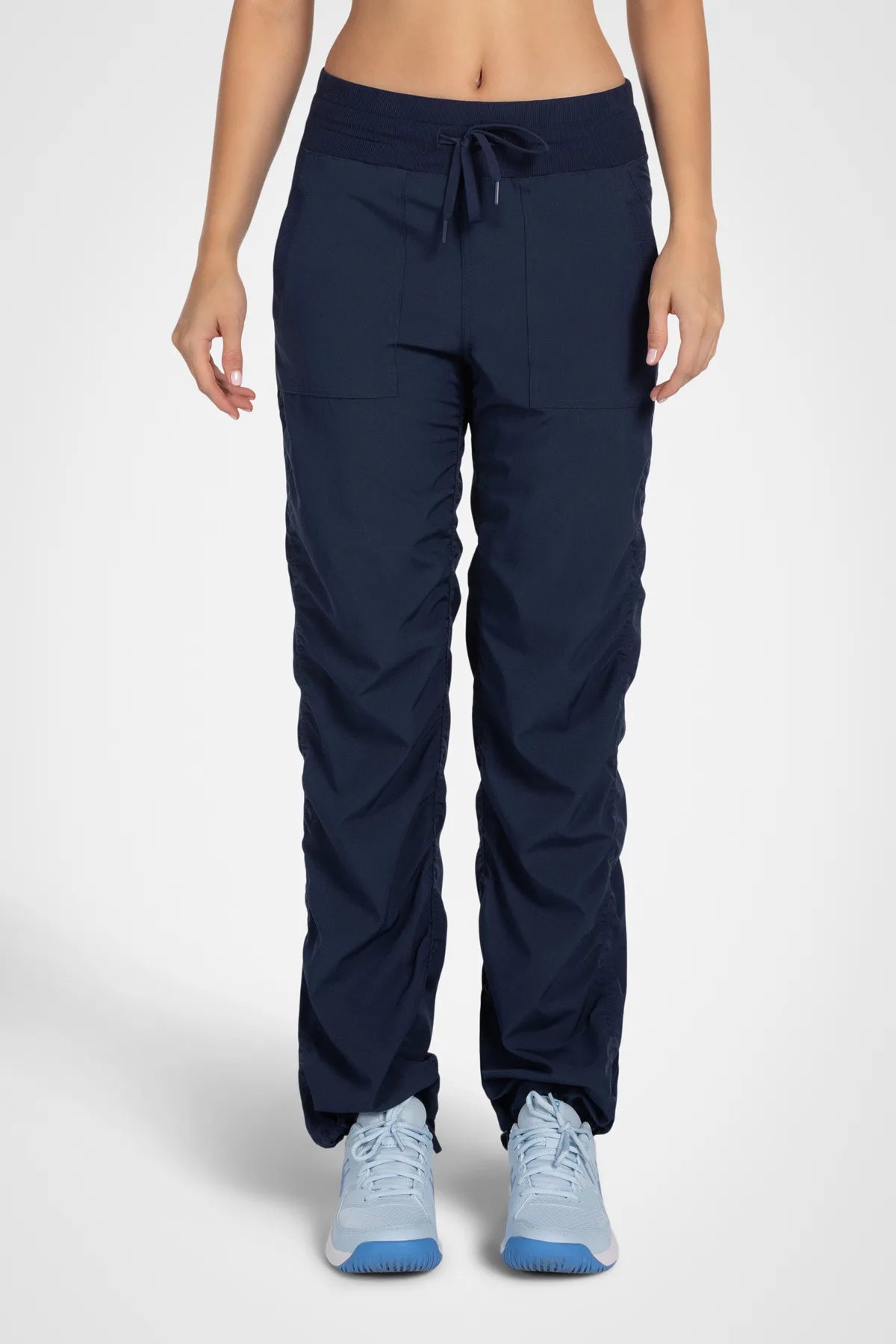 Women’s Black Adventurous Pant, studio product view showing the relaxed tapered silhouette, utility pockets and gathered cuffs.
