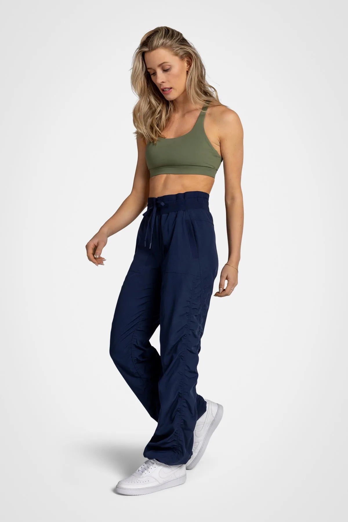 Women’s Mood Indigo Adventurous Pant, rear studio view showing the relaxed fit through the seat and ankle.