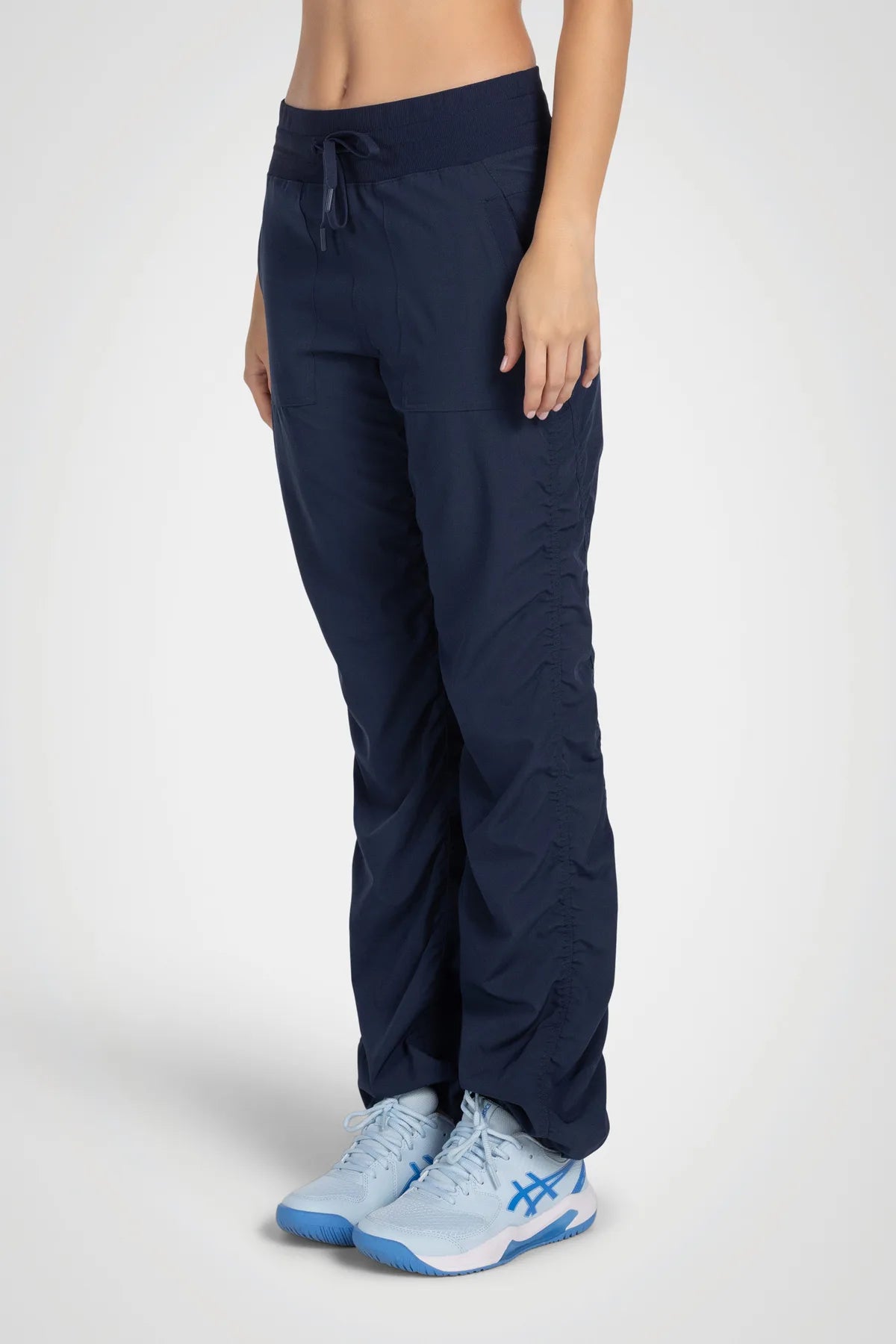 Women’s Mood Indigo Adventurous Pant, close-up of the tapered leg and gathered cuff.