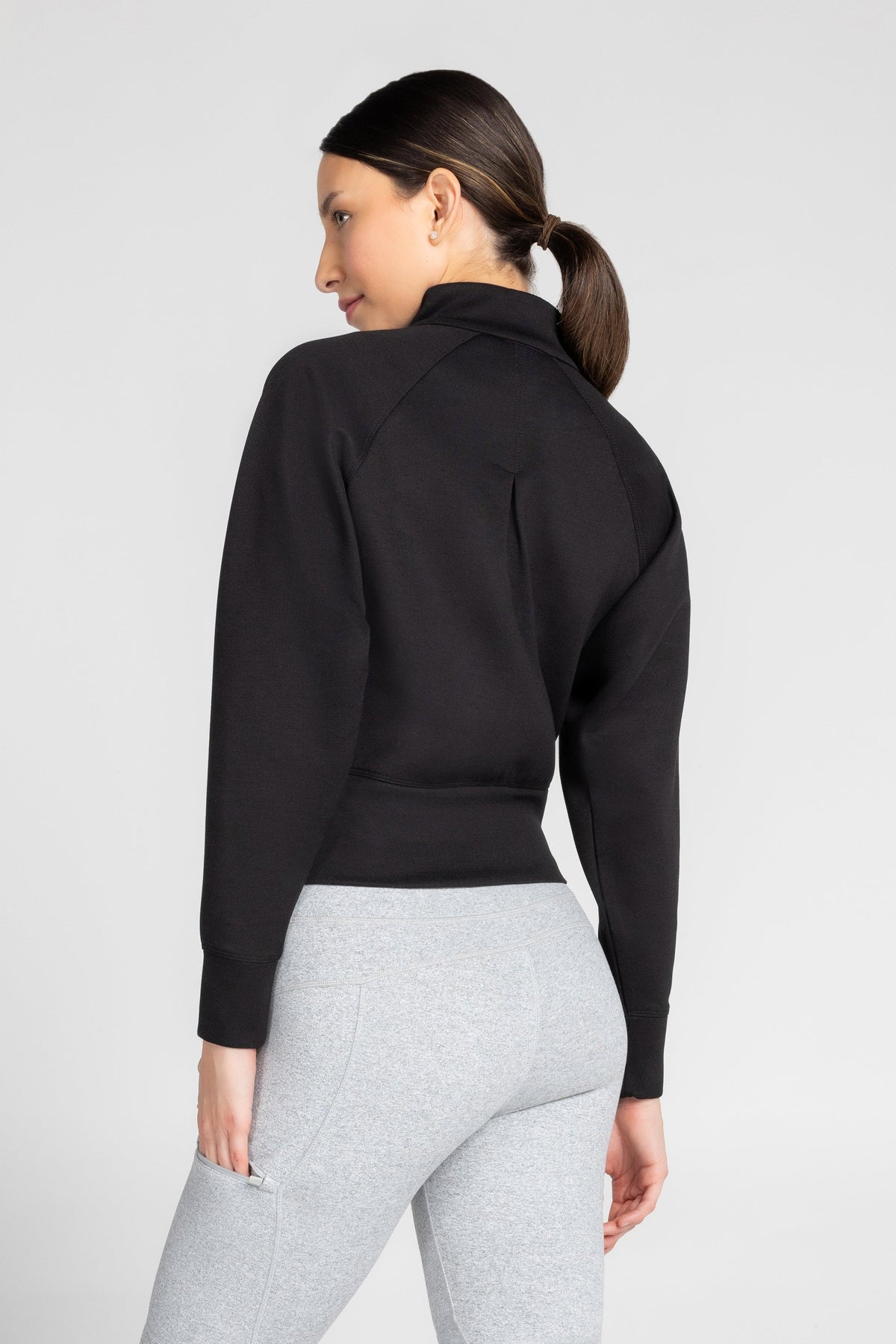 Haut à manches longues et demi-zip en tricot extensible à col montant