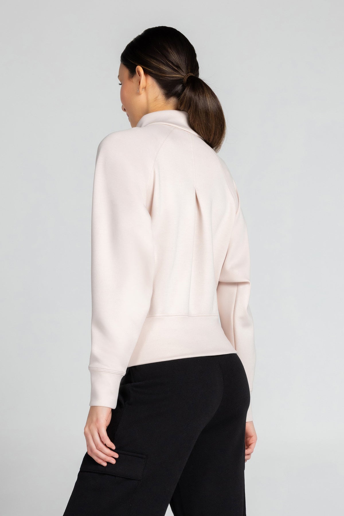 Haut à manches longues et demi-zip en tricot extensible à col montant