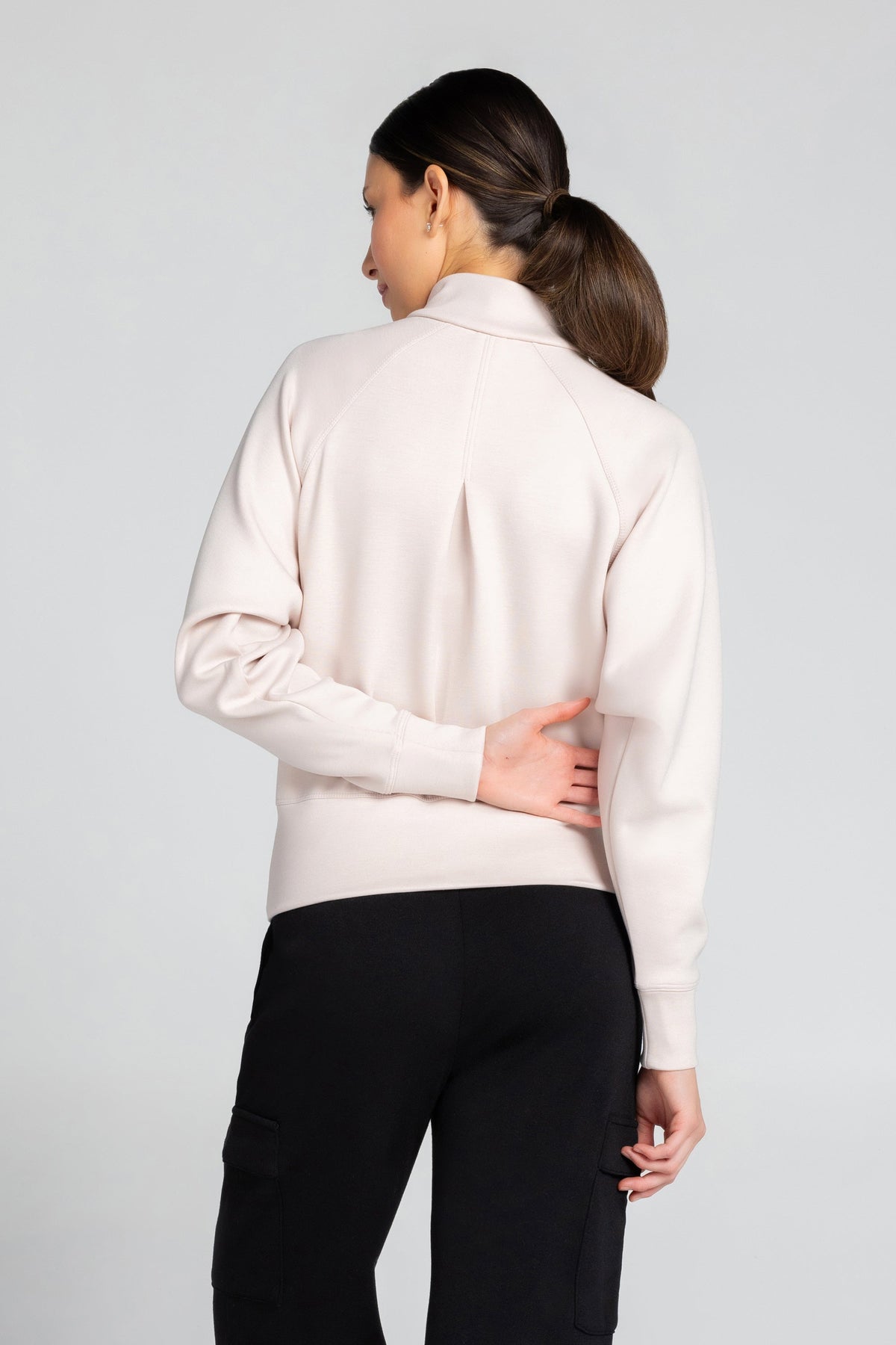 Haut à manches longues et demi-zip en tricot extensible à col montant