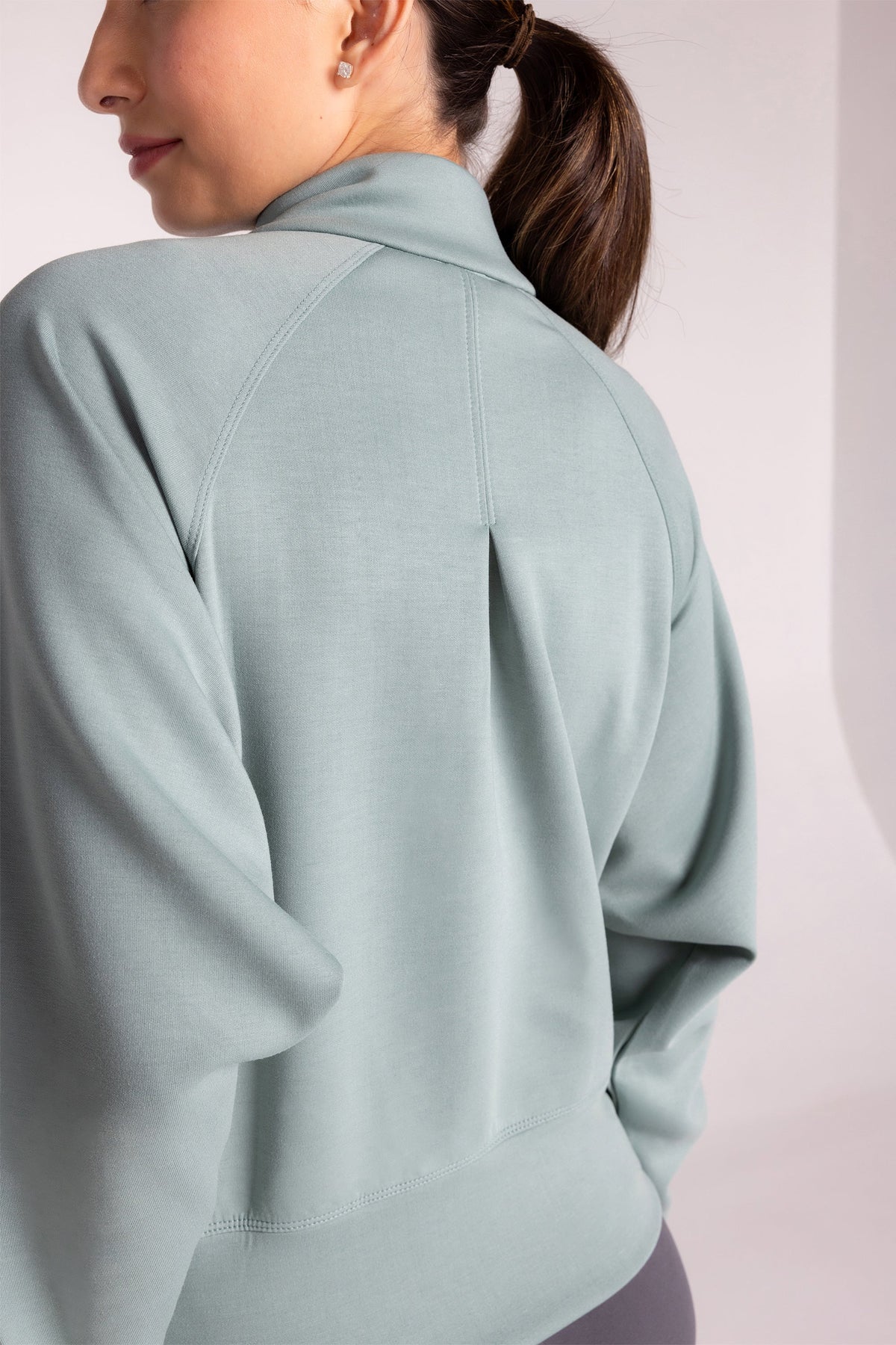 Haut à manches longues et demi-zip en tricot extensible à col montant